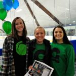 Connecticut College students supporting Green Dot at a school hockey game.