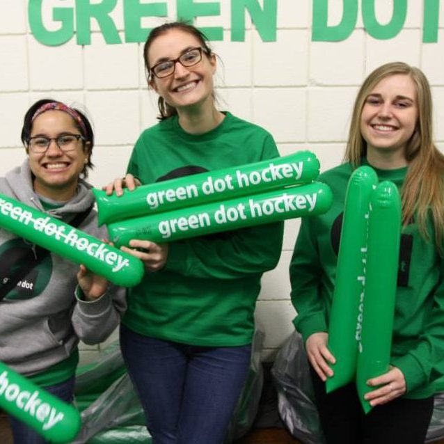 Connecticut College students supporting Green Dot at a school hockey game.