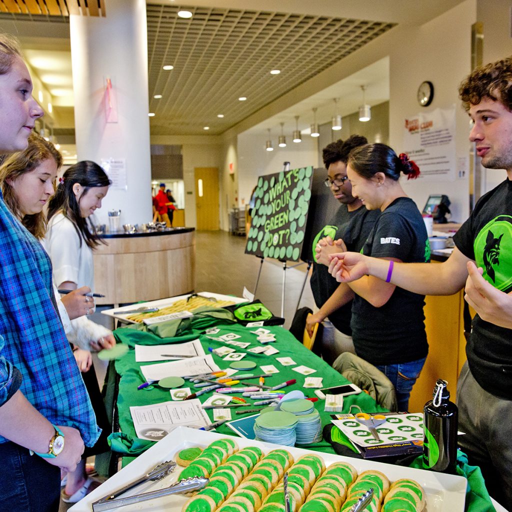 Green Dot Launch Week is all about making Bates safer by raising awareness and engaging the campus in establishing two new norms on campus: Violence is not tolerated We expect everyone to play a role in violence prevention Green Dot Grads ñ Wear Your Shirts! Future Green Dot Grads ñ Wear Green! Green Dot Dinner in Commons from 4-8 p.m. Everything will be decked out in Green Dots. Green Dot Grads, wear your Green Dot t-shirts! We will have a few tables designated for students who want to share intervention moments and experiences. Prior to the dinner, the entire Dining Services staff will have gone through a Green Dot Overview. Staffing the table are Qiu Fogarty Assistant Director of Campus Life Blake Reilly Assistant Director of Residence Life Houston, Korbin K. ë18 of Chicago