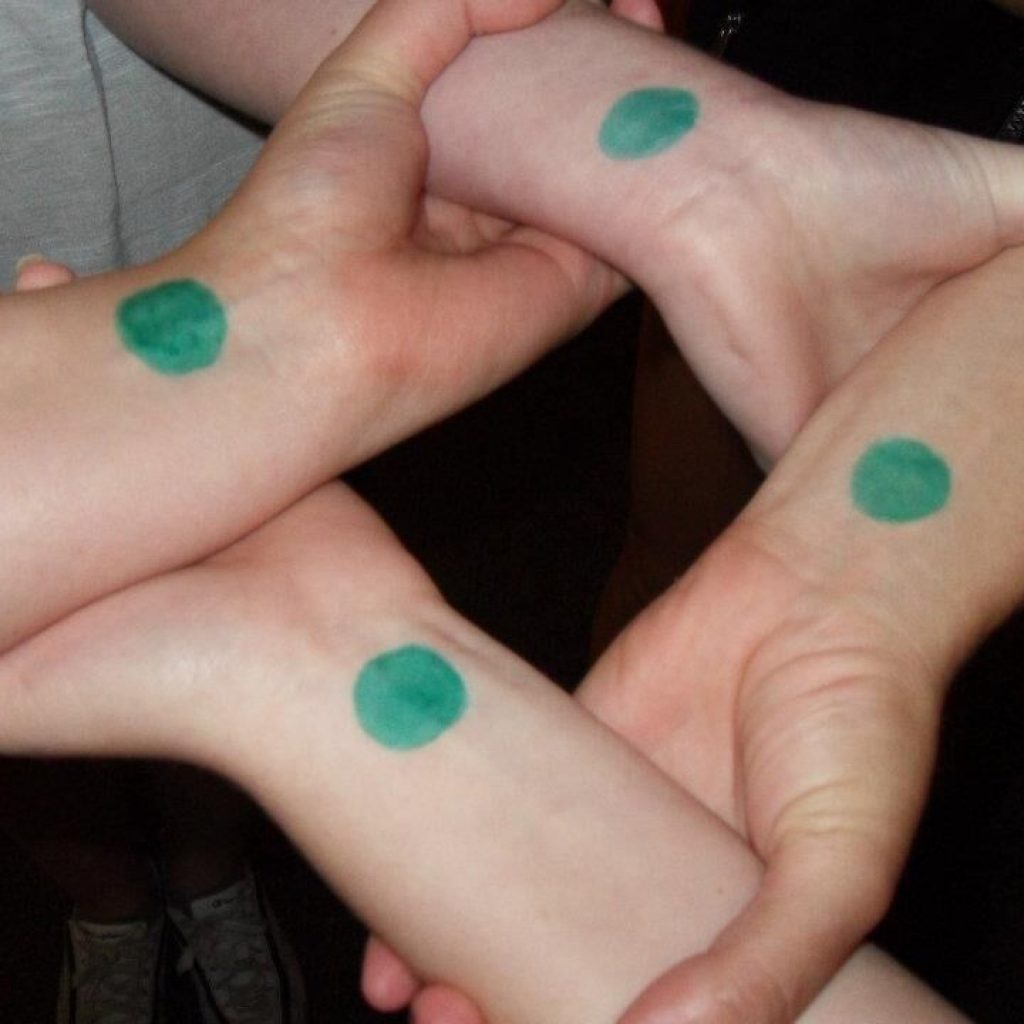 Students draw Green Dots on their wrists